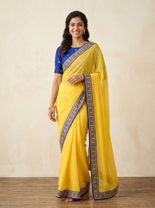 Yellow chiffon saree with blue border – Saanwari